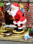 Animated Santa, Toys & Fireplace LED Battery Christmas Village Scene - 20cm