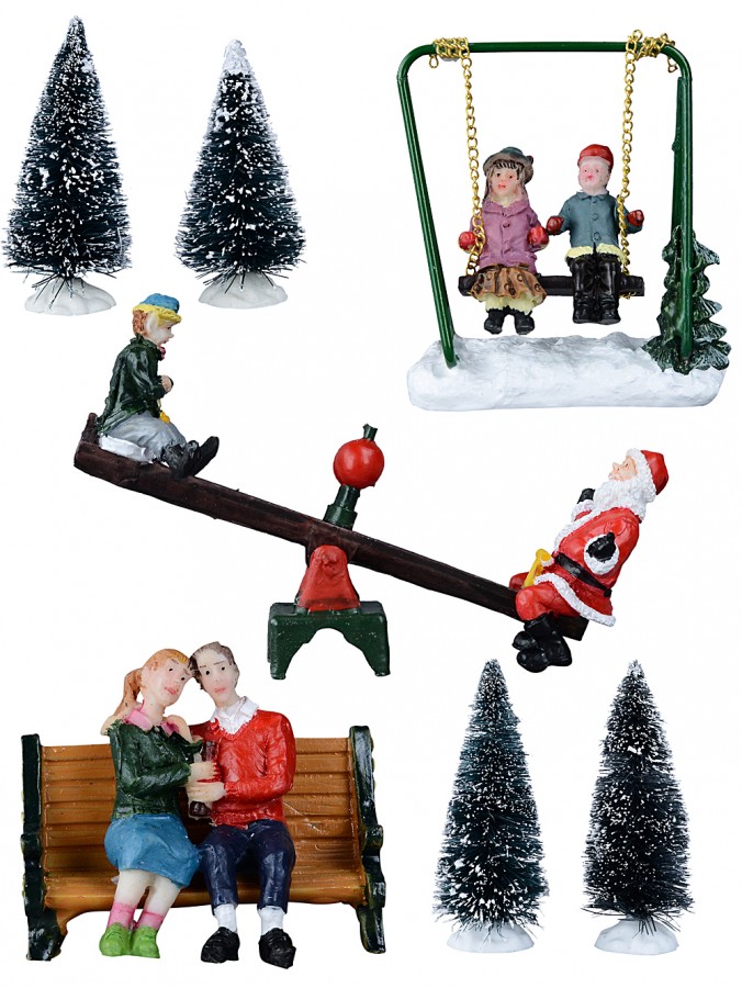 Santa & Family Playing In The Tree Park Christmas Figurines - 7 Piece Set