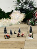 Santa & Family Playing In The Tree Park Christmas Figurines - 7 Piece Set