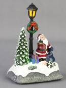 Illuminated Santa with Sack Under a Lamp Post Scene - 12cm