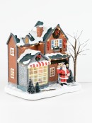Santa With Bell At Factory Illuminated Battery Christmas Village Scene - 18cm