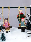 Kids On The Playground Swing Animated LED Christmas Village Scene - 14cm